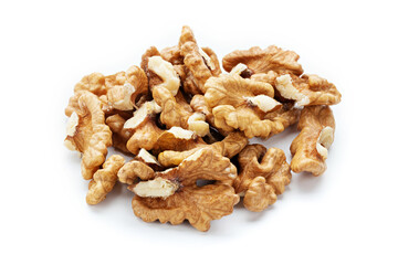 Closeup of big shelled walnuts pile on white background. Nuts are a source of vegetable protein.