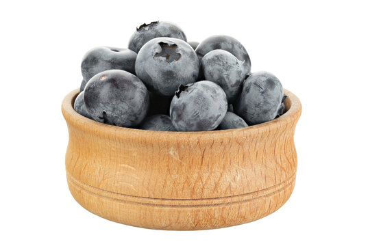 Wild blueberry in a wooden plate isolated on a white background.