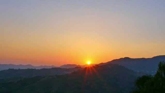 aerial view of Majestic sunset or sunrise landscape Amazing light of nature cloudscape sky..The rays of the sun shine through the clouds at beautiful gradient sunset..Nature environment background.