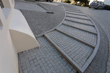 Semi-circular paving stone staircase seen from an upper perspective.