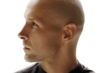 Fototapeta premium A closeup portrait of a bald man's profile looking to his right