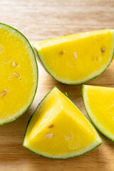 angle view small slices yellow color fresh watermelon at vertical composition
