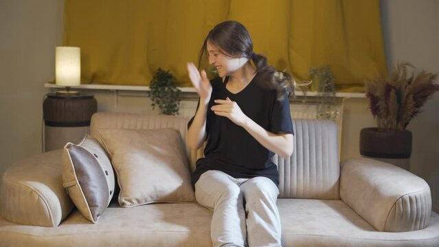 Young woman slapping herself with a nervous breakdown.