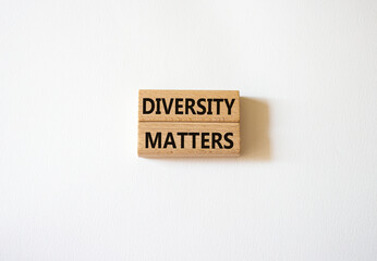 Diversity matters symbol. Wooden blocks with words Diversity matters. Beautiful white background....