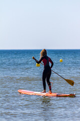 Pratiquante de stand-up paddle à Stella-plage