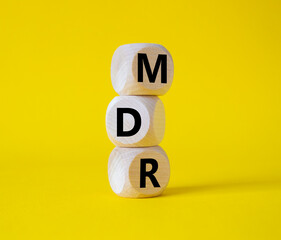 BPM - Business Process Management symbol. Wooden cubes with words BPM. Beautiful yellow background....