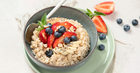 Healthy homemade oatmeal with berries for breakfast.