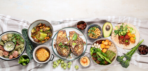 Vegetarian and various vegan dishes on light table. Healthy food concept with vitamins, fiber and antioxidants.