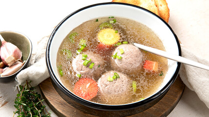 Knodel soup bowl and bread