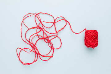 Red jute rope with complicated end of rope, unravels the confused rope