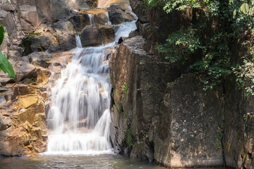 Fototapeta na wymiar clean and fresh water high mountain waterfall at Thailand National Park in holiday