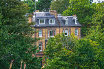 A house surrounded by trees in Hampstead Heath in London, England