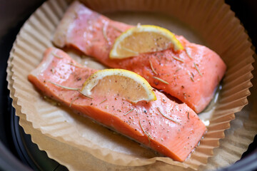 Tasty cooked salmon steak with lemon. Healthy and easy meals from air fryer.