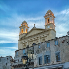 Fototapeta na wymiar Bastia in Corsica, the saint-jean-baptiste church in the old harbor, sunset 