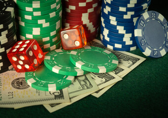 Dice and stacks of chips on money in a poker club. A successful combination brought a rich win