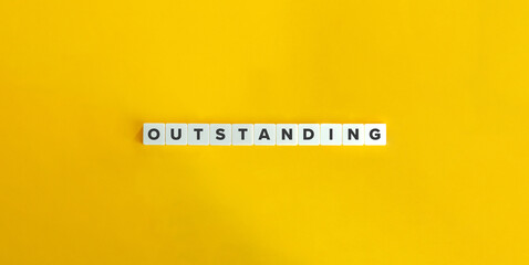 Outstanding Word on Block Letter Tiles on Yellow Background. Minimal Aesthetic.