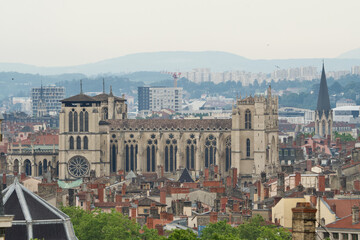 Fototapeta na wymiar Side view of the famous Lyon Cathedral ( Saint Jean-Baptiste cathedral) with the Saint george church behind in Rhone Alpes, France.