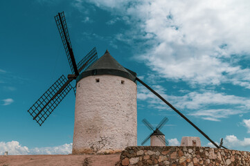 Old stone windmills on a hill above the Toledo town of Consuegra (Spain)