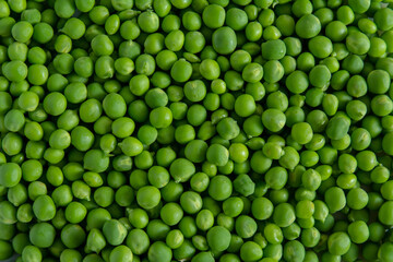 Fresh sweet green peas background texture complete all the picture - top view.