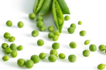 Fresh green vegetable pea pods and beans isolated on white background
