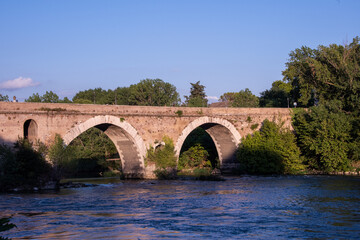 Milvian Bridge at sunset, on river Tiber in Rome	

