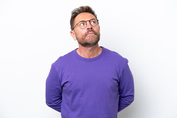 Obraz premium Middle age caucasian man isolated on white background and looking up