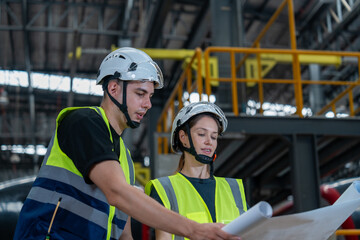 Railway technicians collaborate with engineers to inspect the electric train propulsion system in order to maintain the electric trains in the depot.