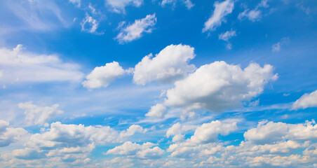 Blue sky background with soft white clouds