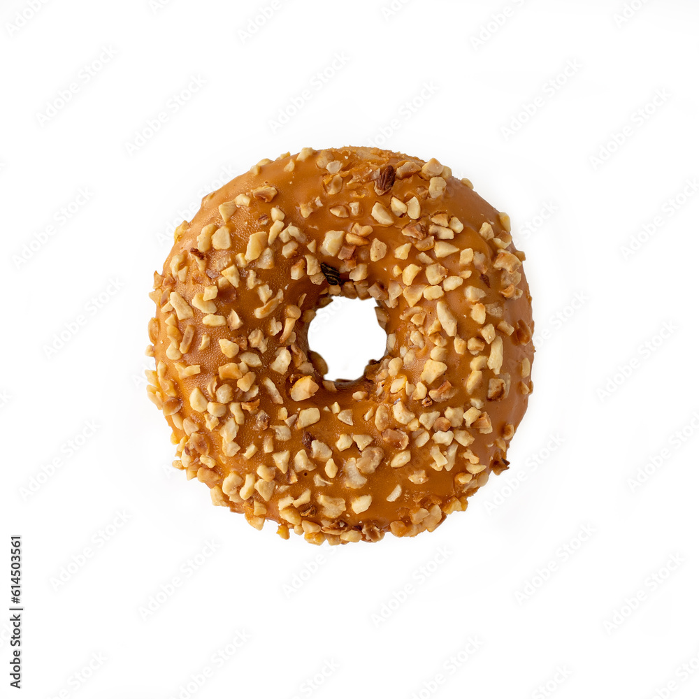 Poster Donut with caramel filling with nuts on a white background. Isolate.Top view