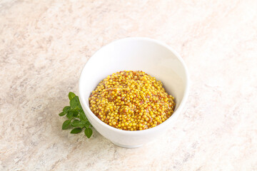 Grain mustard sauce in the bowl