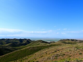 Archarly pass. View from top of the hills above the road connecting Kaochagay and Saryozek