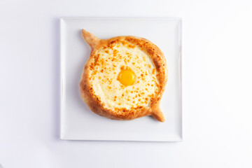 Traditional pie with cheese and egg yolk. Khachapuri.
