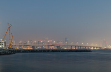Fototapeta na wymiar bridge over the sea in Abu dhabi during a humid evening