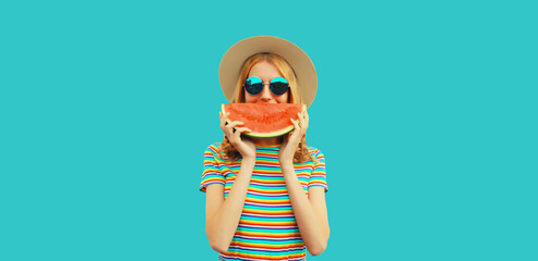 Summer portrait of happy smiling young woman with fresh juicy slice of watermelon wearing straw hat...