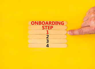 Time to step 1 onboarding symbol. Concept words Onboarding step 1 on wooden sticks. Businessman hand. Beautiful yellow table yellow background. Business success step 1 onboarding concept. Copy space.