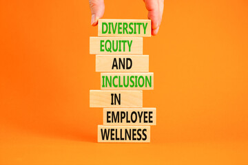 Diversity equity inclusion symbol. Concept words Diversity Equity and Inclusion in employee wellness on wooden block. Beautiful orange background. Diversity equity inclusion concept. Copy space.