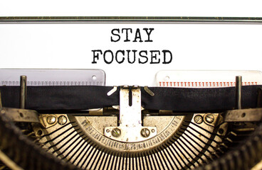 Stay focused symbol. Concept words Stay focused typed on beautiful old retro typewriter. Beautiful white background. Business, support, motivation, psychological and stay focused concept. Copy space.