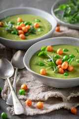 Delicious pea soup made of vegetables and herbs.