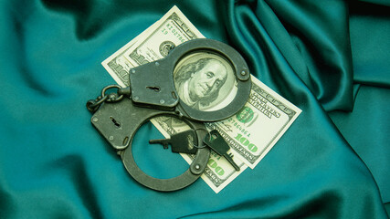 Dollars and shackles with drugs on a beautiful background close-up