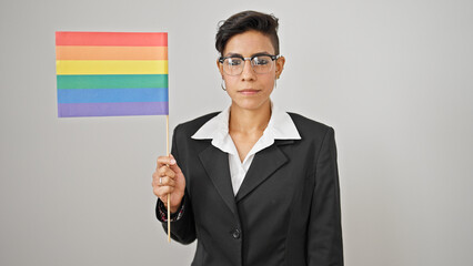 Young beautiful hispanic woman business worker holding rainbow flag over isolated white background