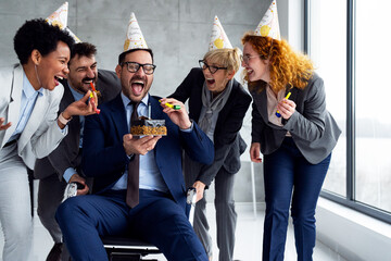 Business team celebrating birthday to colleagues