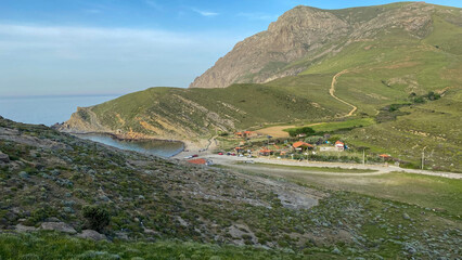 Naklejka premium Yildizkoy beach view from the green hills of Gokceada at sunset, Yildizkoy coast is the one of popular beach in Gokceada. Canakkale, Turkey