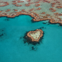 Heart Reef in the Whitsundays Queensland Australia. Famous reef that is shaped like a heart. The Great Barrier Reef aeria is heavily impacted by climate change.