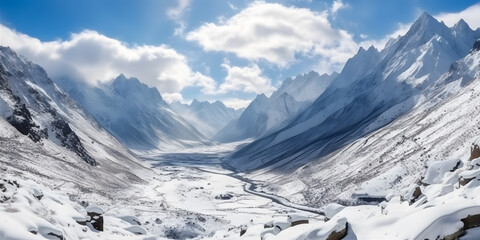 Trekking through a Snowy Mountain Range, enveloped in mist, under a clear blue sky