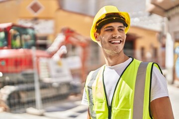 Young hispanic man architect smiling confident standing at park