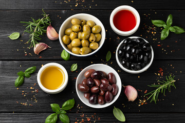 Assortment of fresh green, kalamata and black olives in bowl. Healthy snack