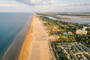 Morning on the still deserted beach. Umbrella beach for relaxing and sun set beach. Bibione, Italy © Zedspider