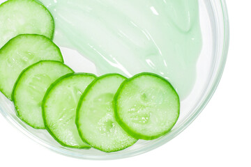 Thinly sliced slices of fresh green cucumber in a Petri dish. A smeared smear of green cucumber...