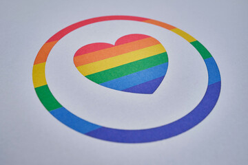 Rainbow heart on a light paper background. LGBT flag. LGBTQIA Pride Month in June. Lesbian gay bisexual transgender. Gender equality. Human rights and tolerance. rainbow flag