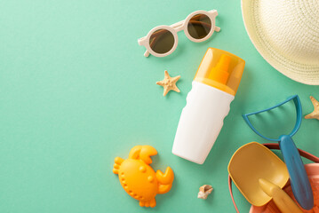 Promote the idea of kids' ultraviolet safety on vacation through this top view composition, showcasing sunscreen, marine shells, kids' sand toys, sunhat and sunglasses on teal isolated background